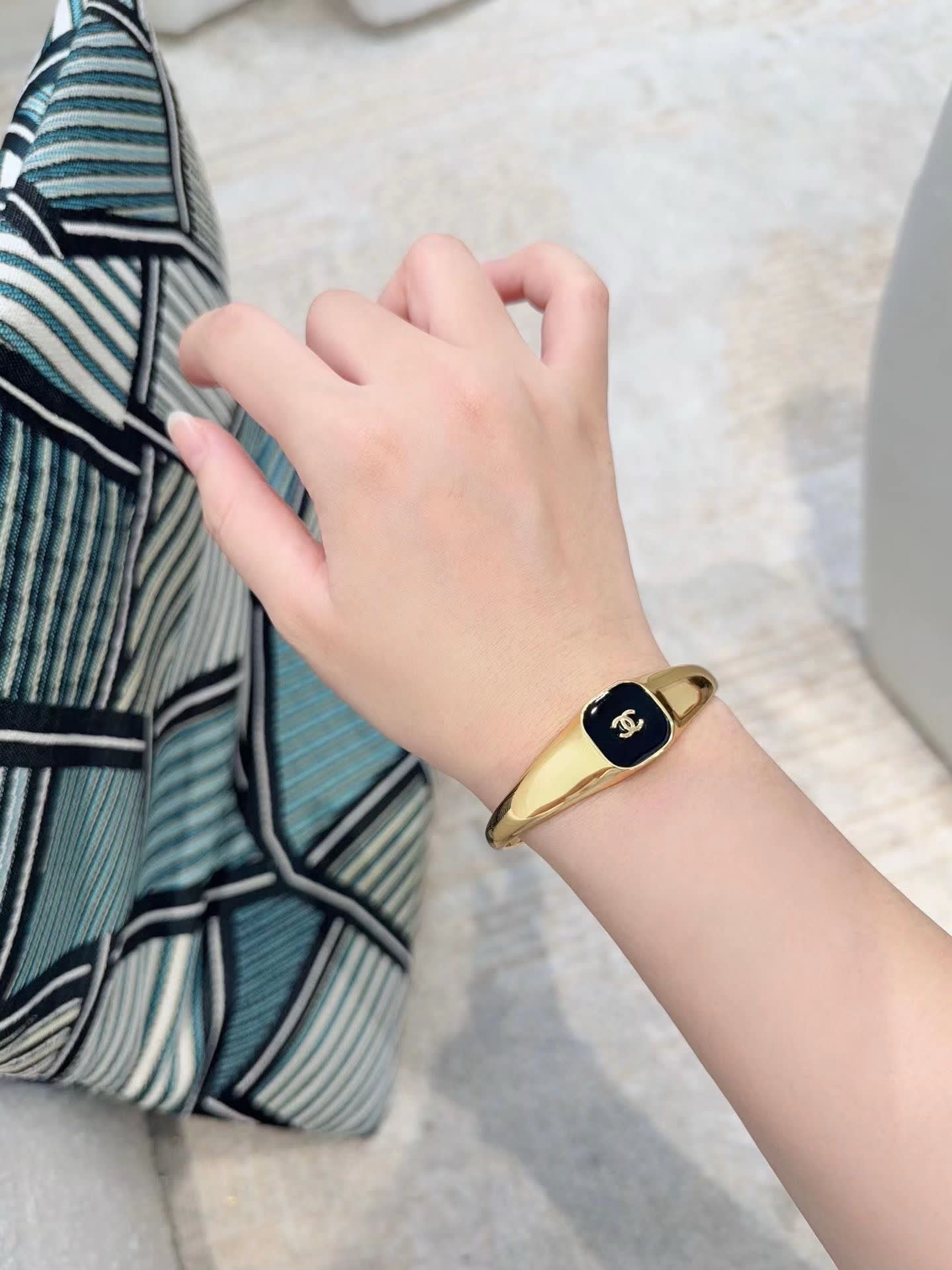 Chanel Gold Tone Bracelet with Black Enamel CC Logo