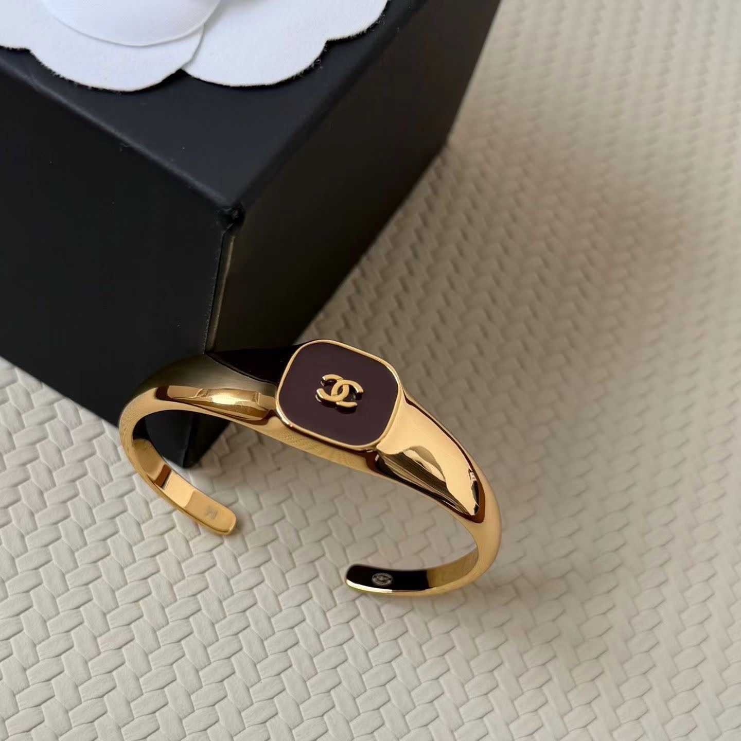 Chanel Gold Tone Bracelet with Black Enamel CC Logo