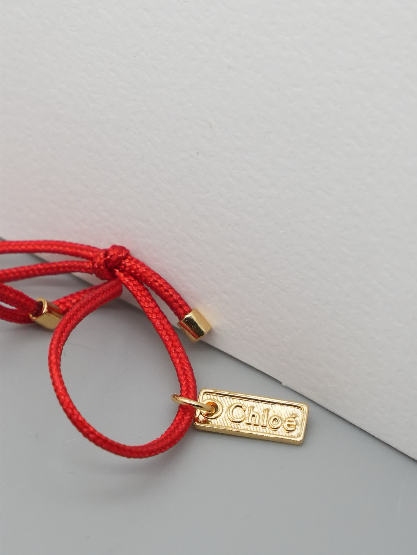 Chloe Chloé Red Rope Bracelet with Gold 'Chloé' Charm