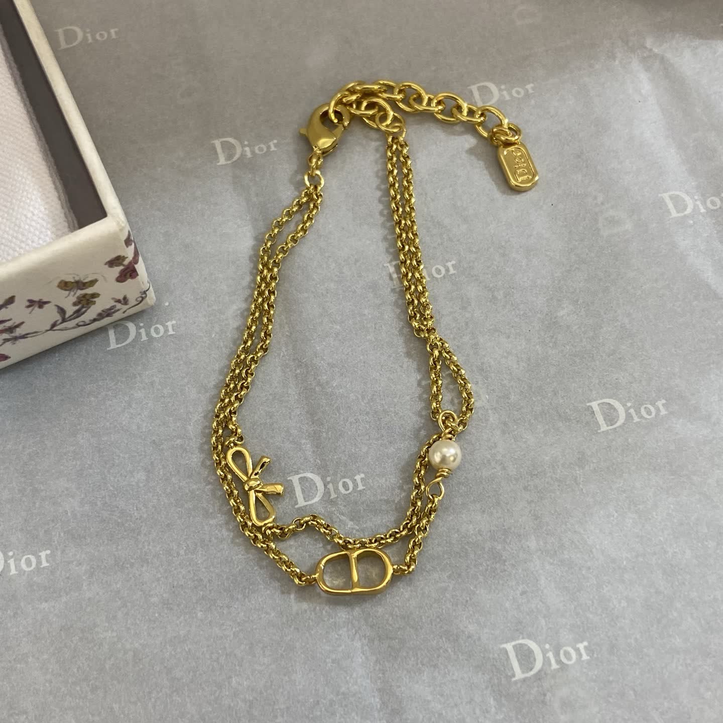 Dior Gold Tone Double Chain Bracelet with Pearl and Bow