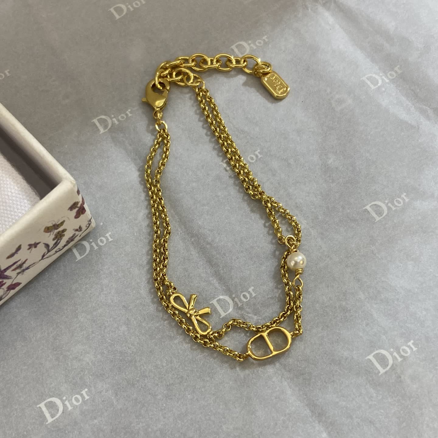 Dior Gold Tone Double Chain Bracelet with Pearl and Bow