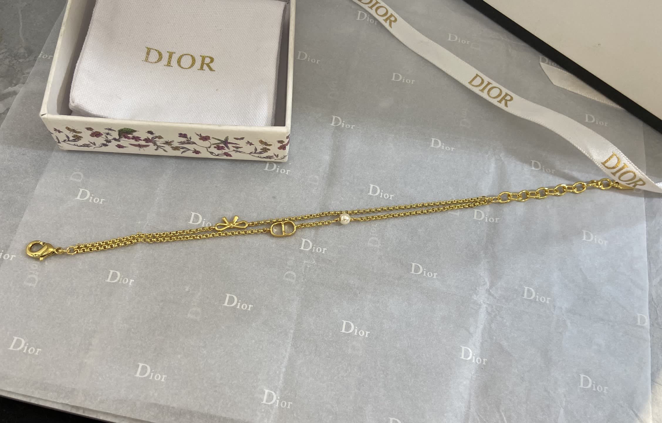 Dior Gold Tone Double Chain Bracelet with Pearl and Bow