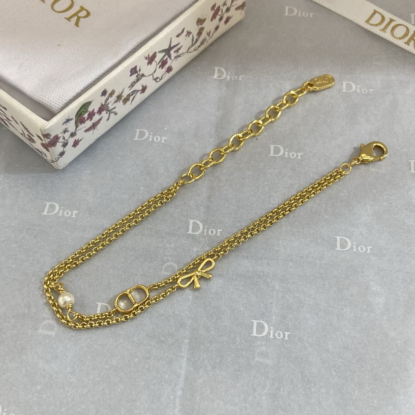 Dior Gold Tone Double Chain Bracelet with Pearl and Bow