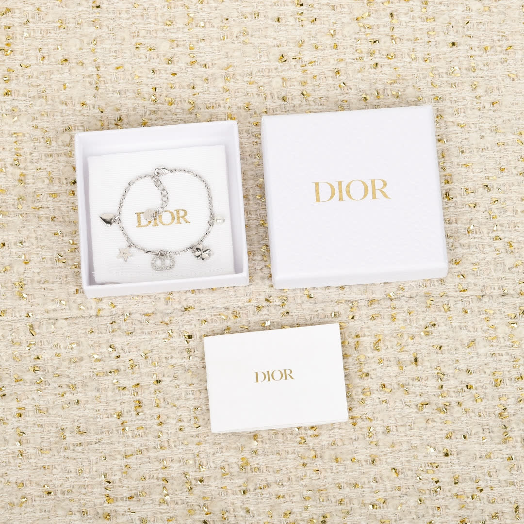 Van Cleef & Arpels Silver Charm Bracelet Van Cleef & Arpels Silver Charm Bracelet