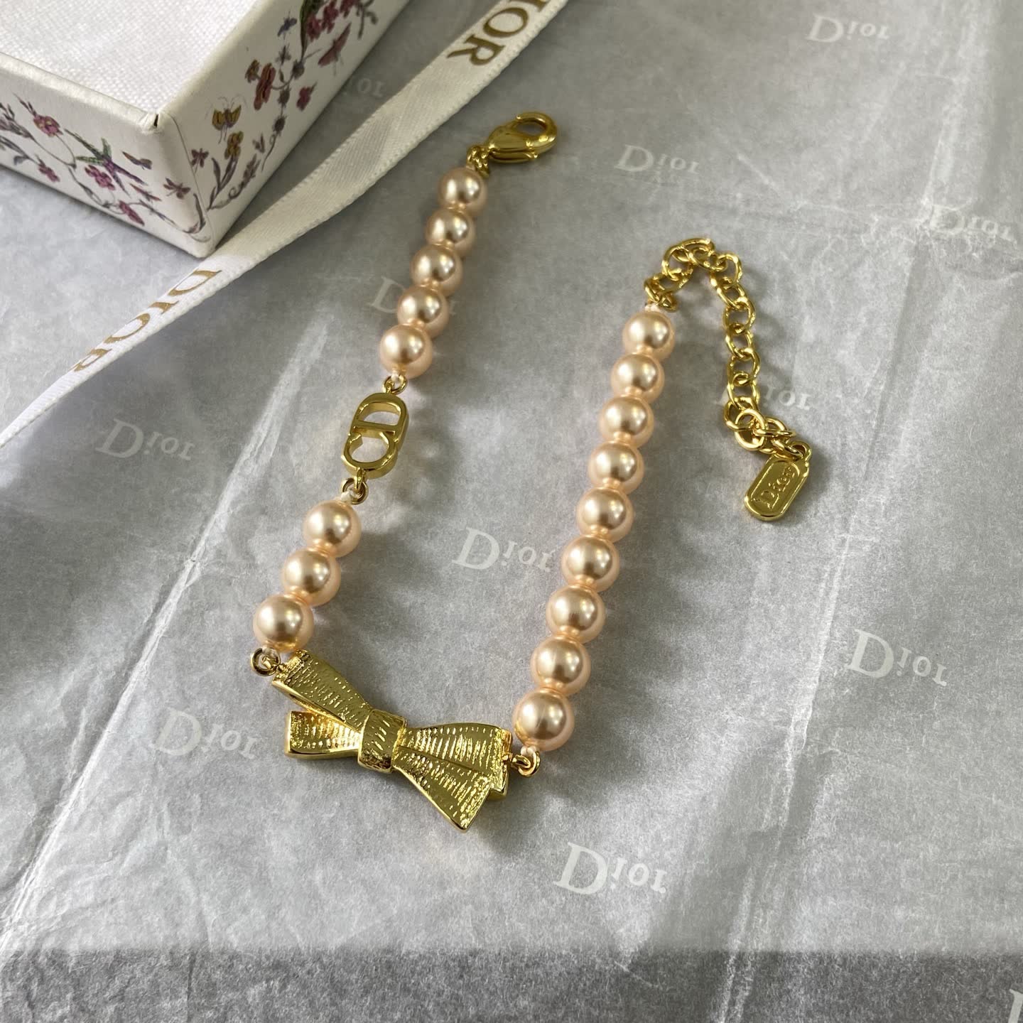 Dior Pearl Bracelet with Gold Bow Dior Pearl Bracelet with Gold Bow