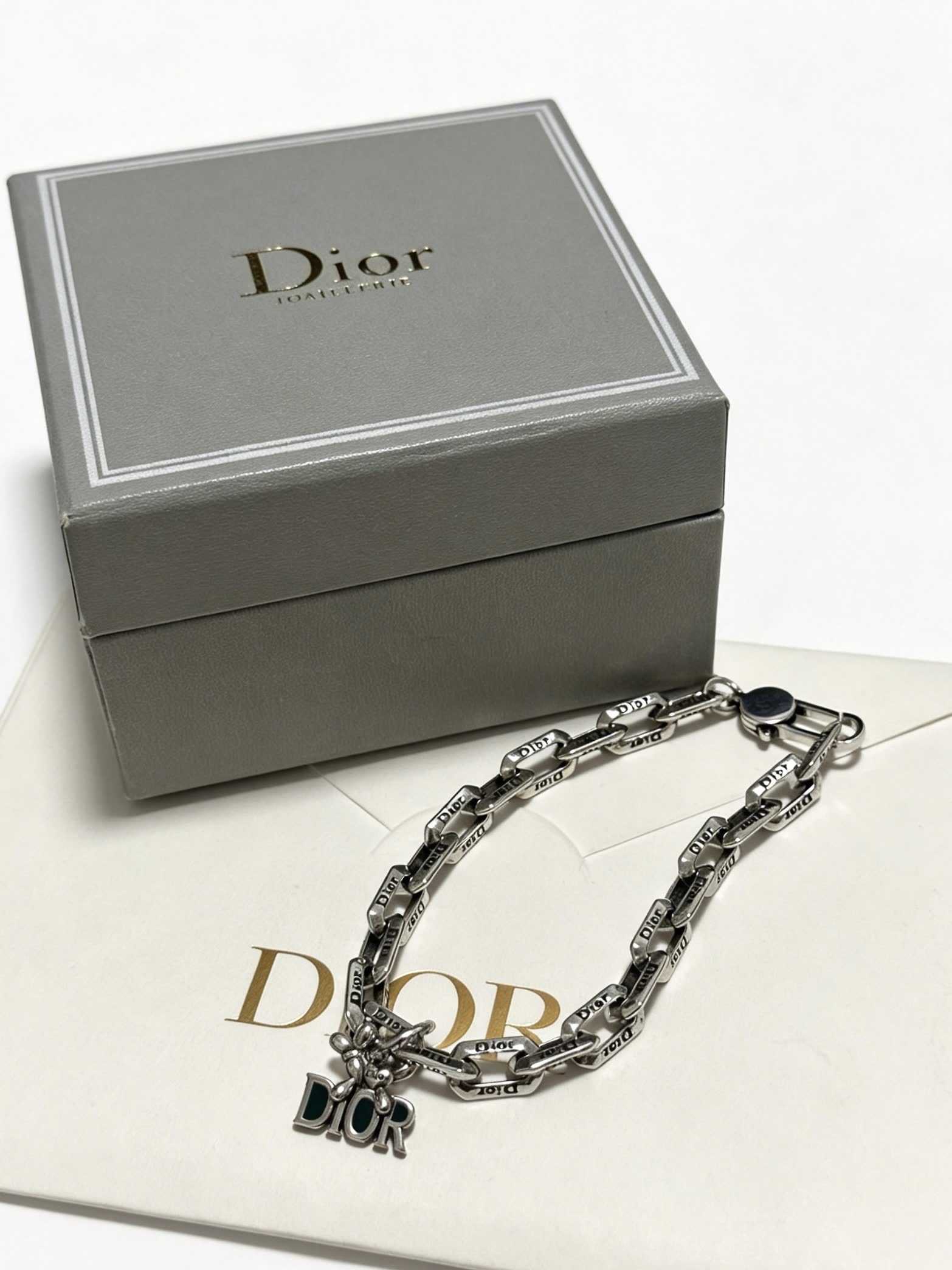 Dior Silver Tone Bracelet with Logo Charm