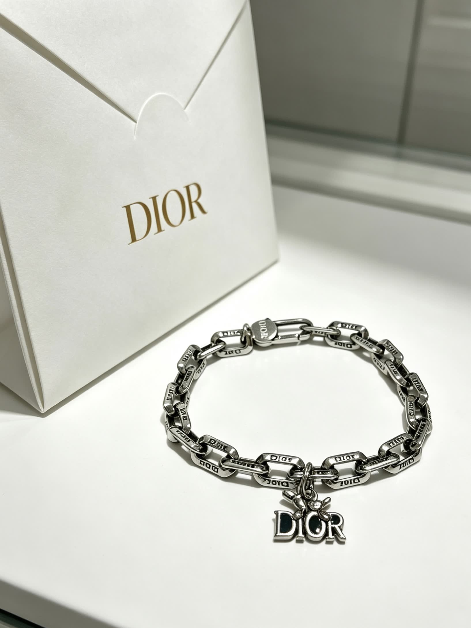 Dior Silver Tone Bracelet with Logo Charm