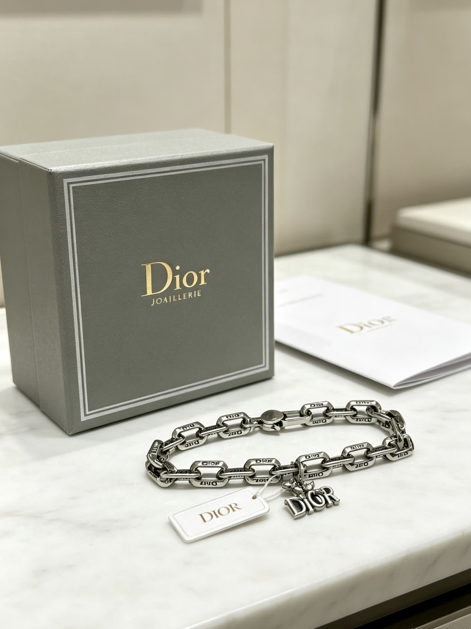 Dior Silver Tone Bracelet with Logo Charm