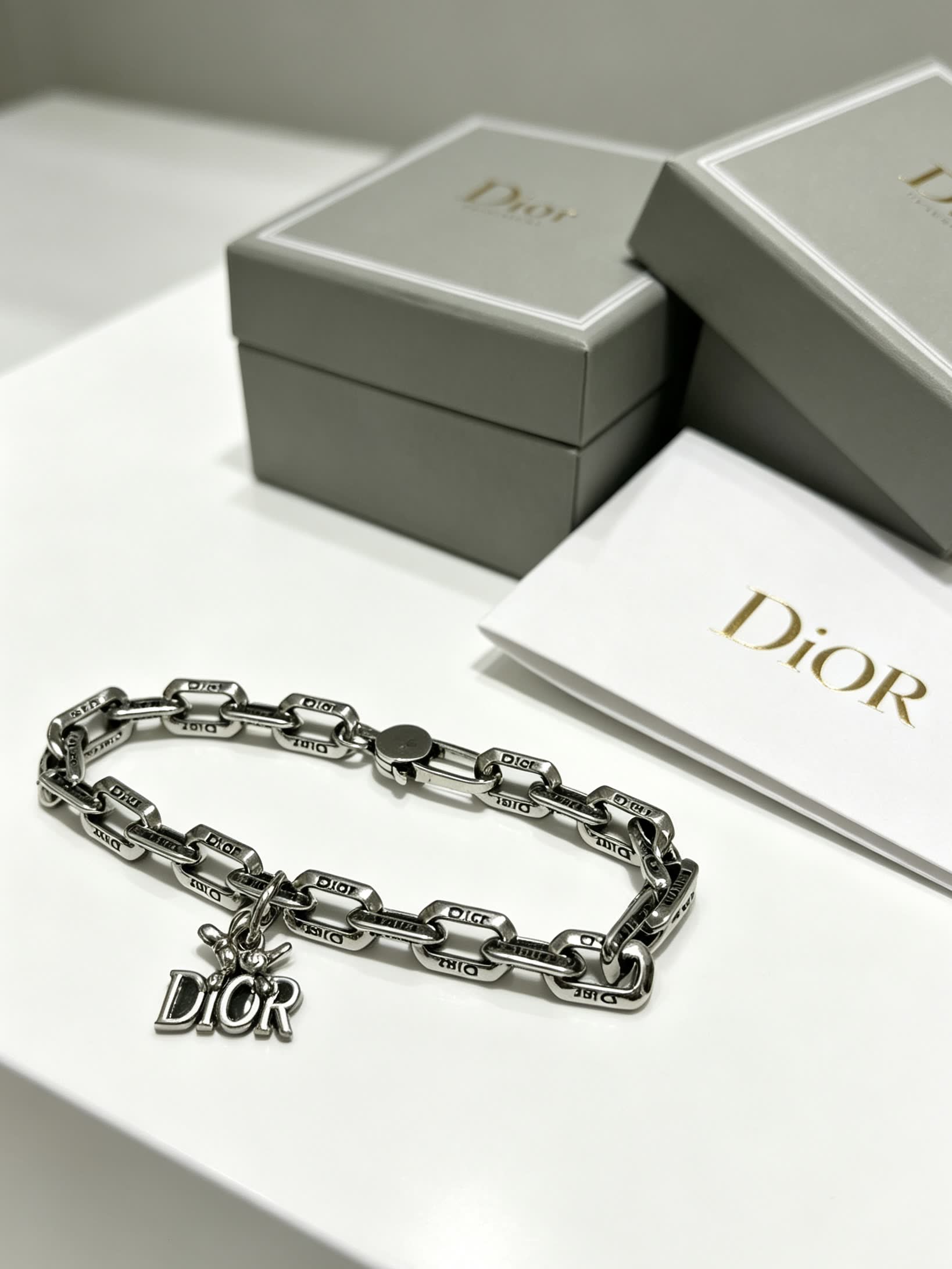 Dior Silver Tone Bracelet with Logo Charm