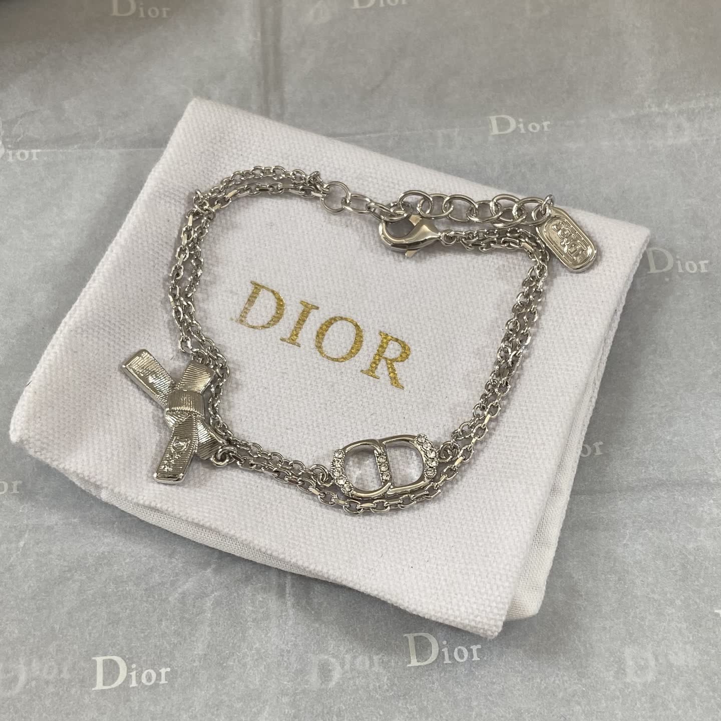 Dior Silver Tone Bracelet with Bow and Double 'D' Charm Dior Silver Tone Bracelet with Bow and Double 'D' Charm