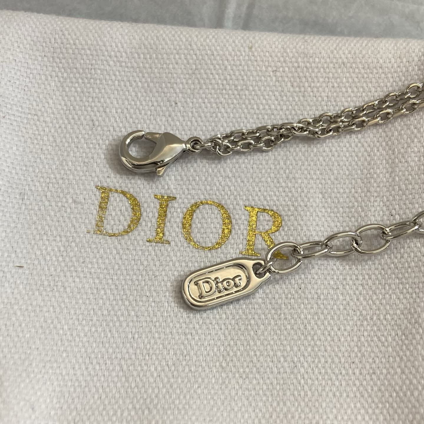 Dior Silver Tone Bracelet with Bow and Double 'D' Charm
