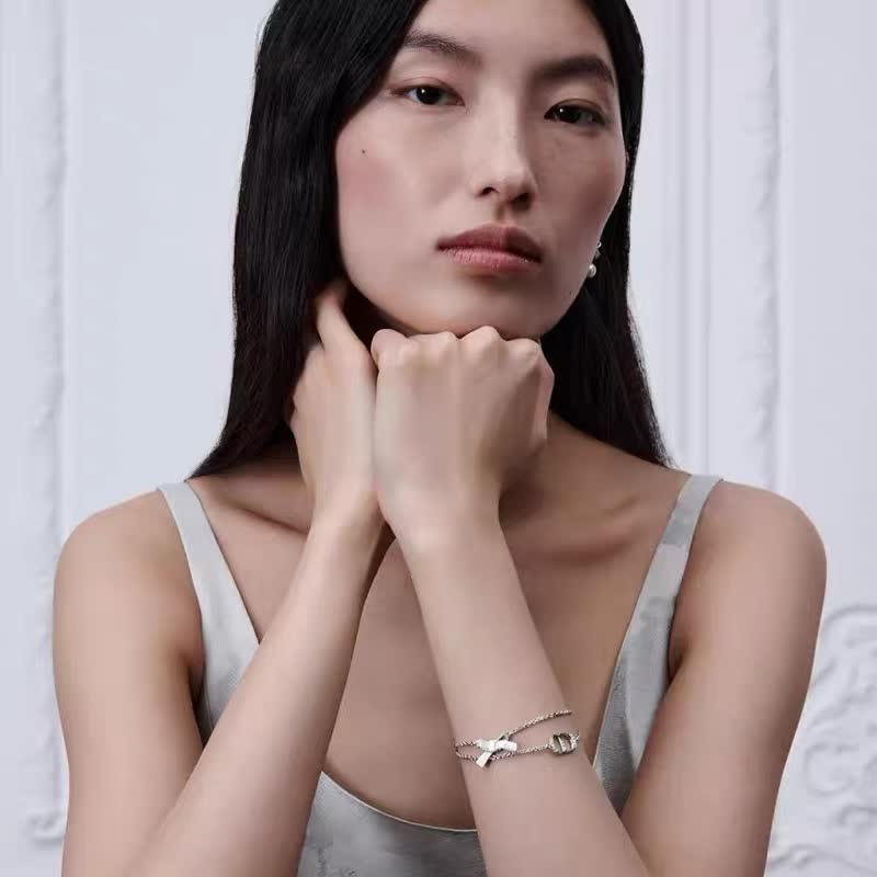 Dior Silver Tone Bracelet with Bow and Double 'D' Charm
