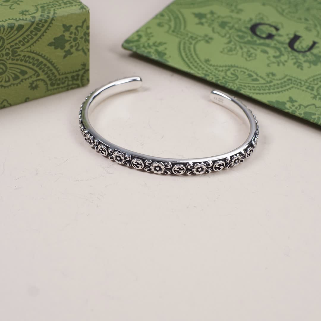 Gucci Silver Floral Embossed Cuff Bracelet
