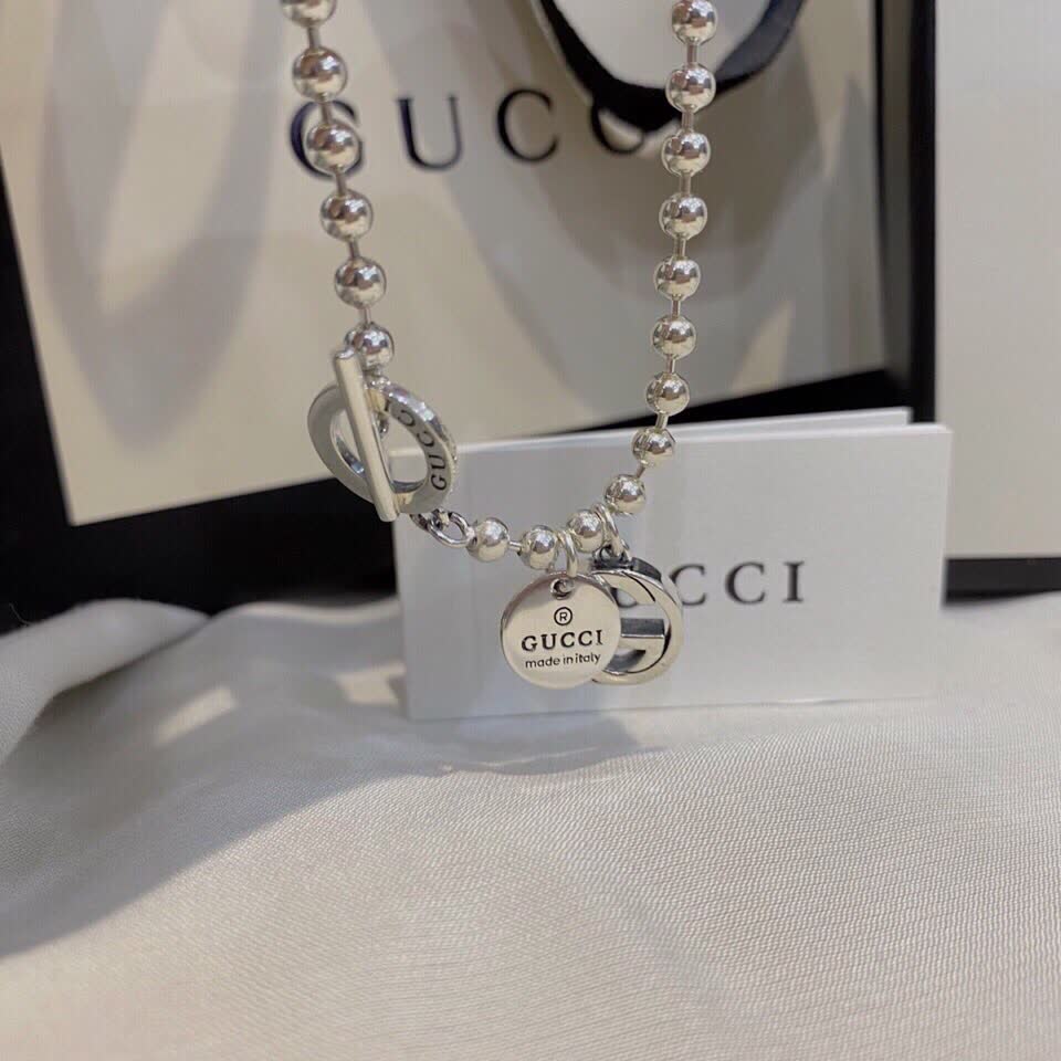 Gucci Silver Beaded Bracelet with Logo Charm
