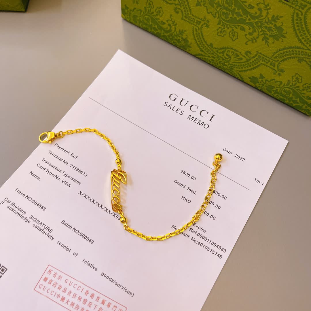 Gucci Gold Tone Logo Bracelet