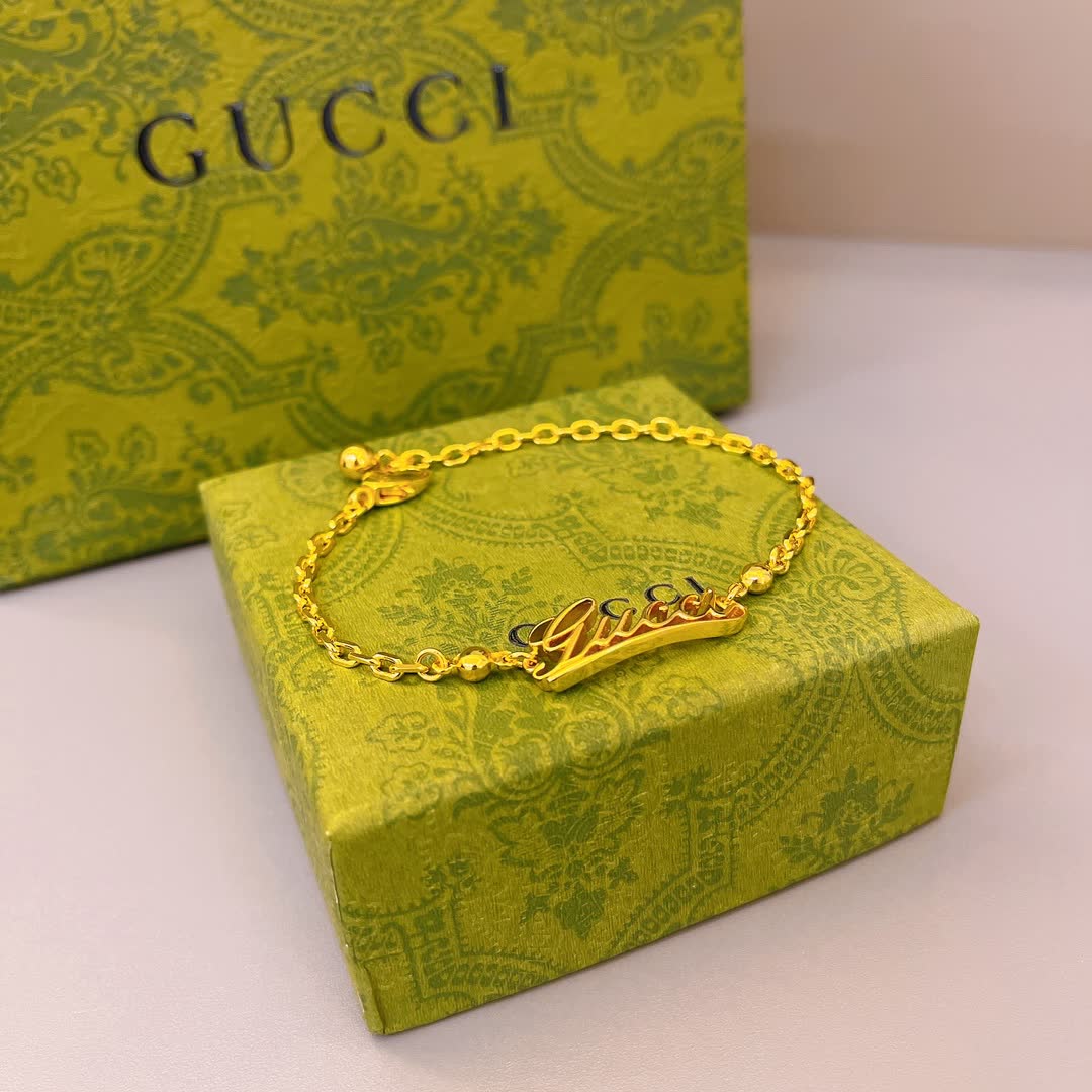 Gucci Gold Tone Logo Bracelet