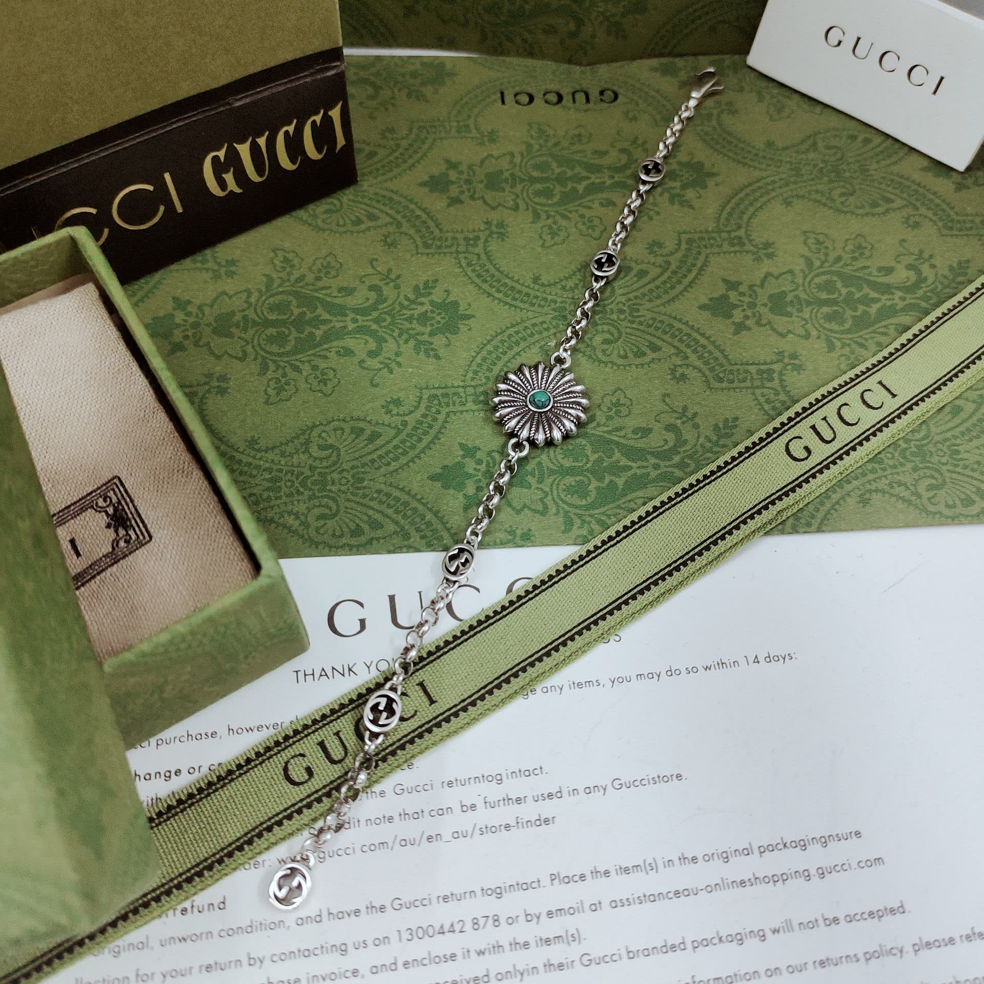 Gucci Silver Bracelet with Flower and Logo Charms Gucci Silver Bracelet with Flower and Logo Charms