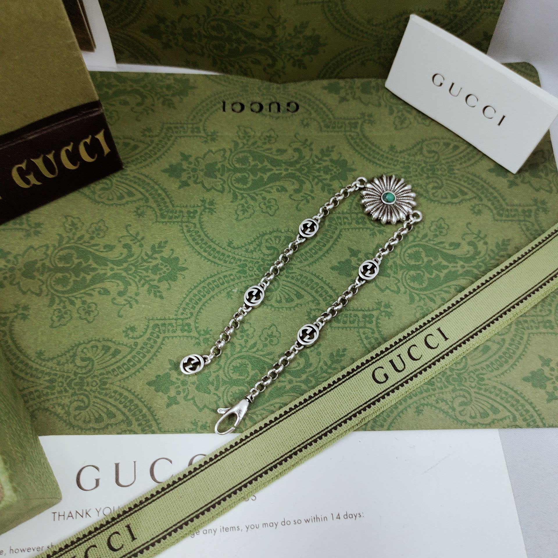 Gucci Silver Bracelet with Flower and Logo Charms