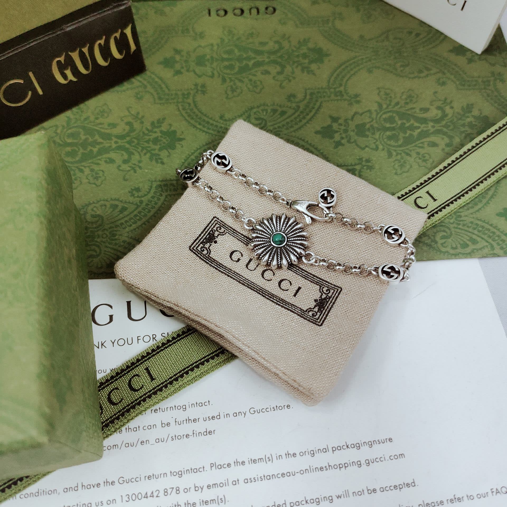 Gucci Silver Bracelet with Flower and Logo Charms