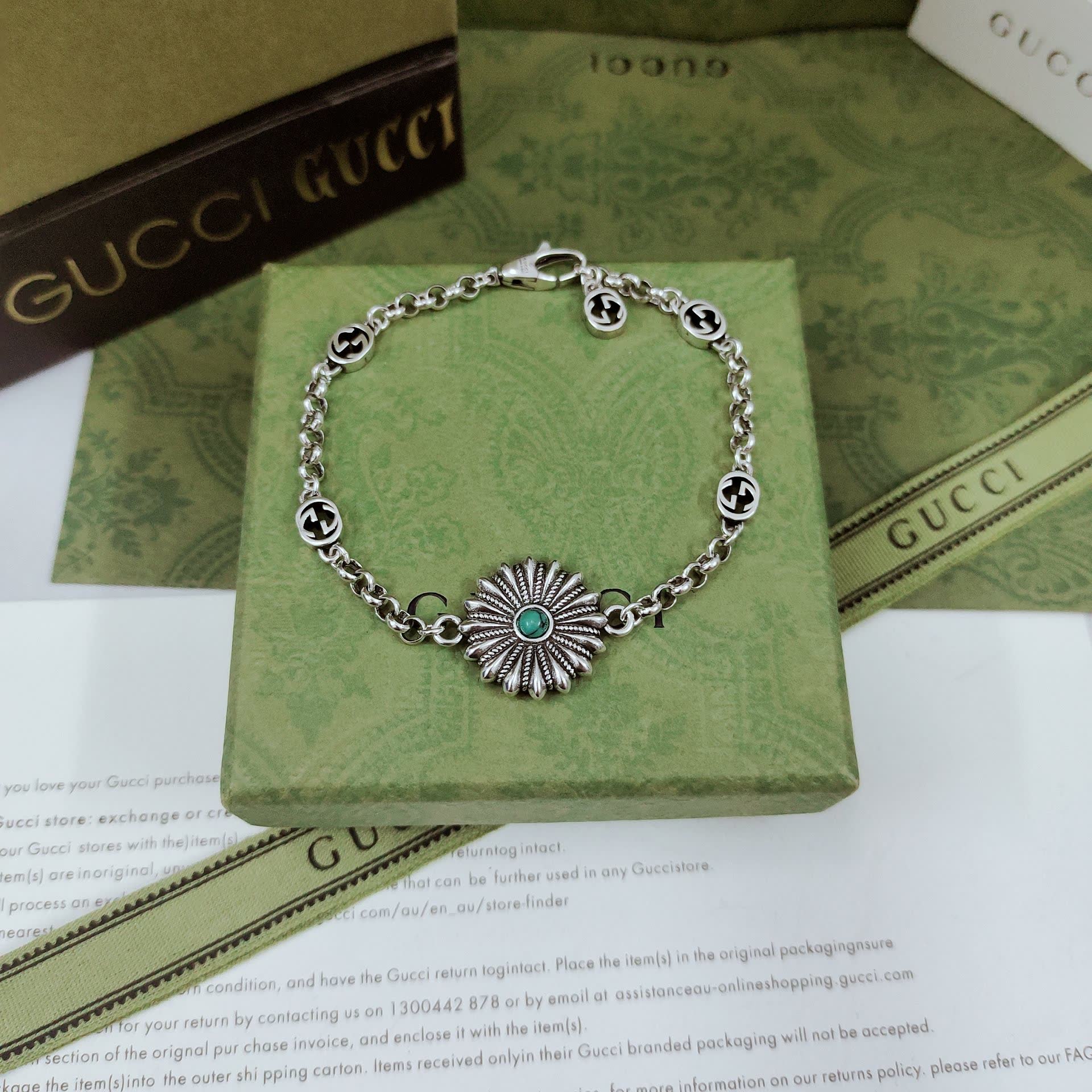 Gucci Silver Bracelet with Flower and Logo Charms