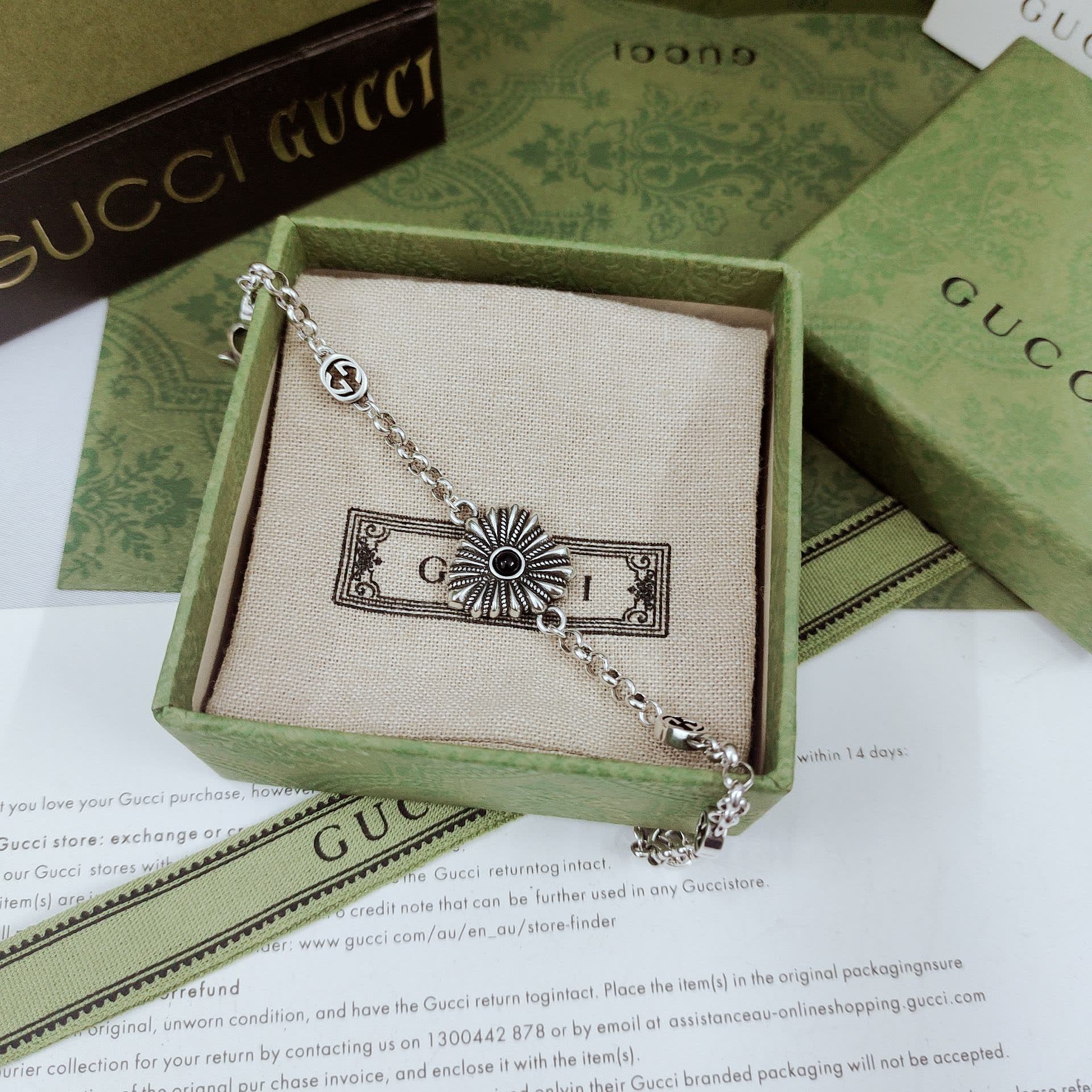 Gucci Silver Bracelet with Flower and Logo Charms