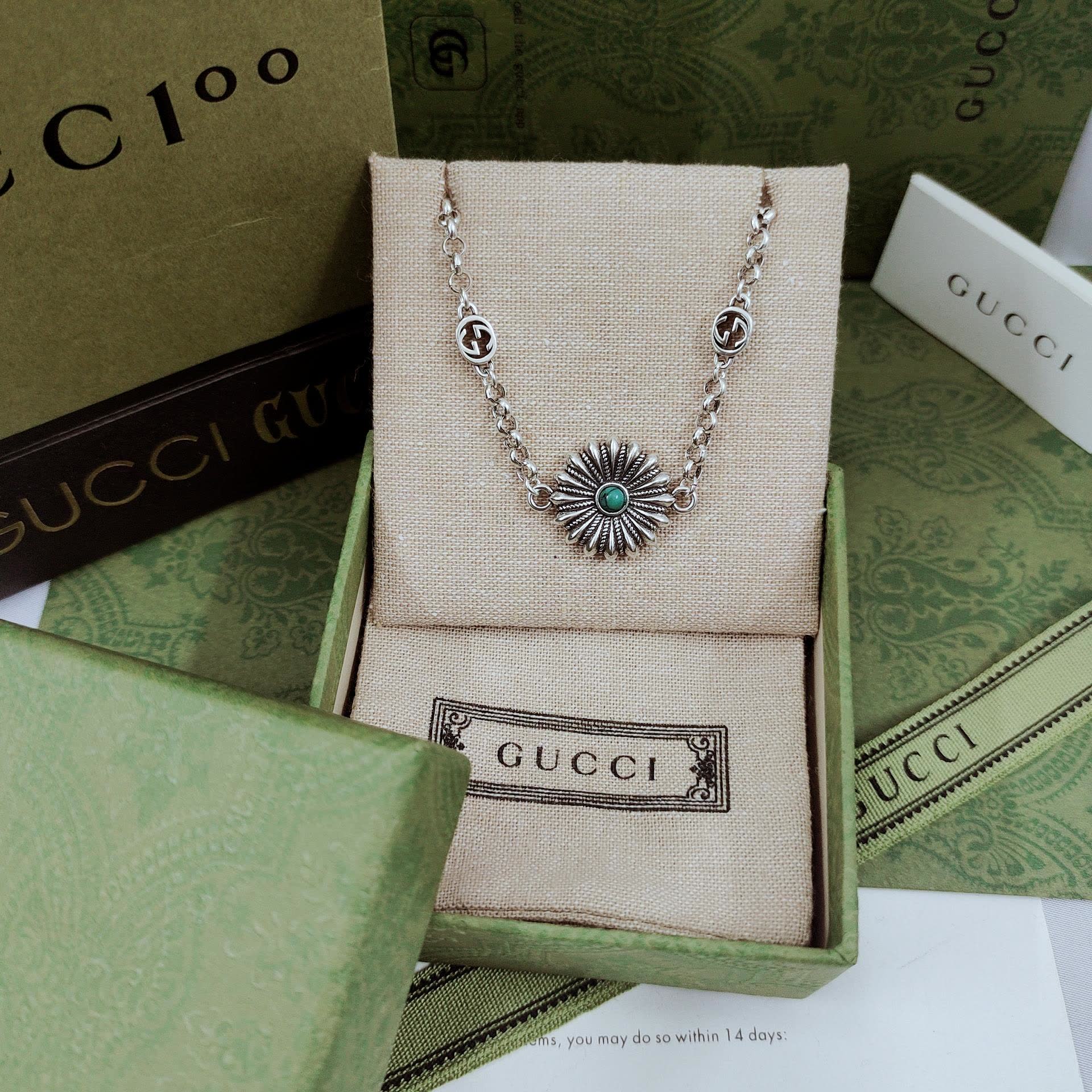 Gucci Silver Bracelet with Flower and Logo Charms
