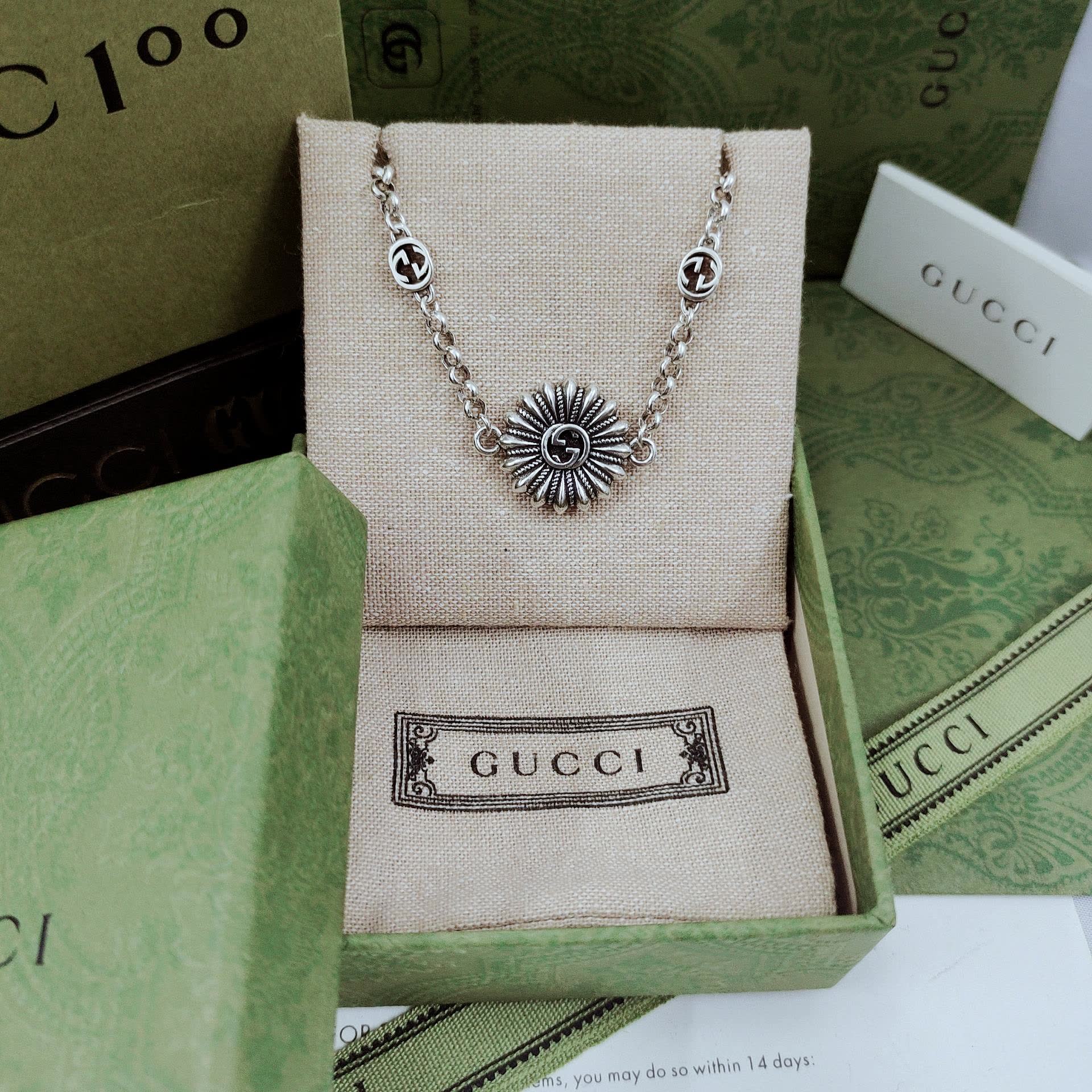 Gucci Silver Bracelet with Flower and Logo Charms
