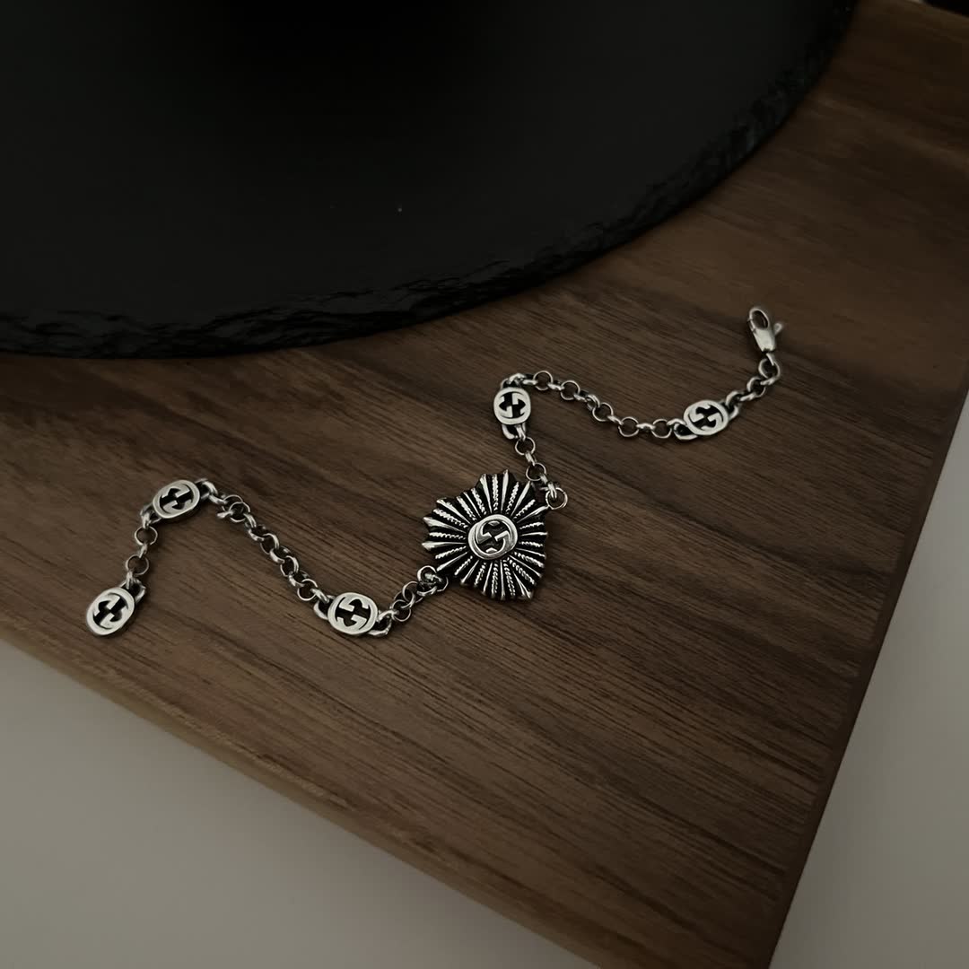 Gucci Silver Bracelet with Interlocking G Logo and Sunburst Design