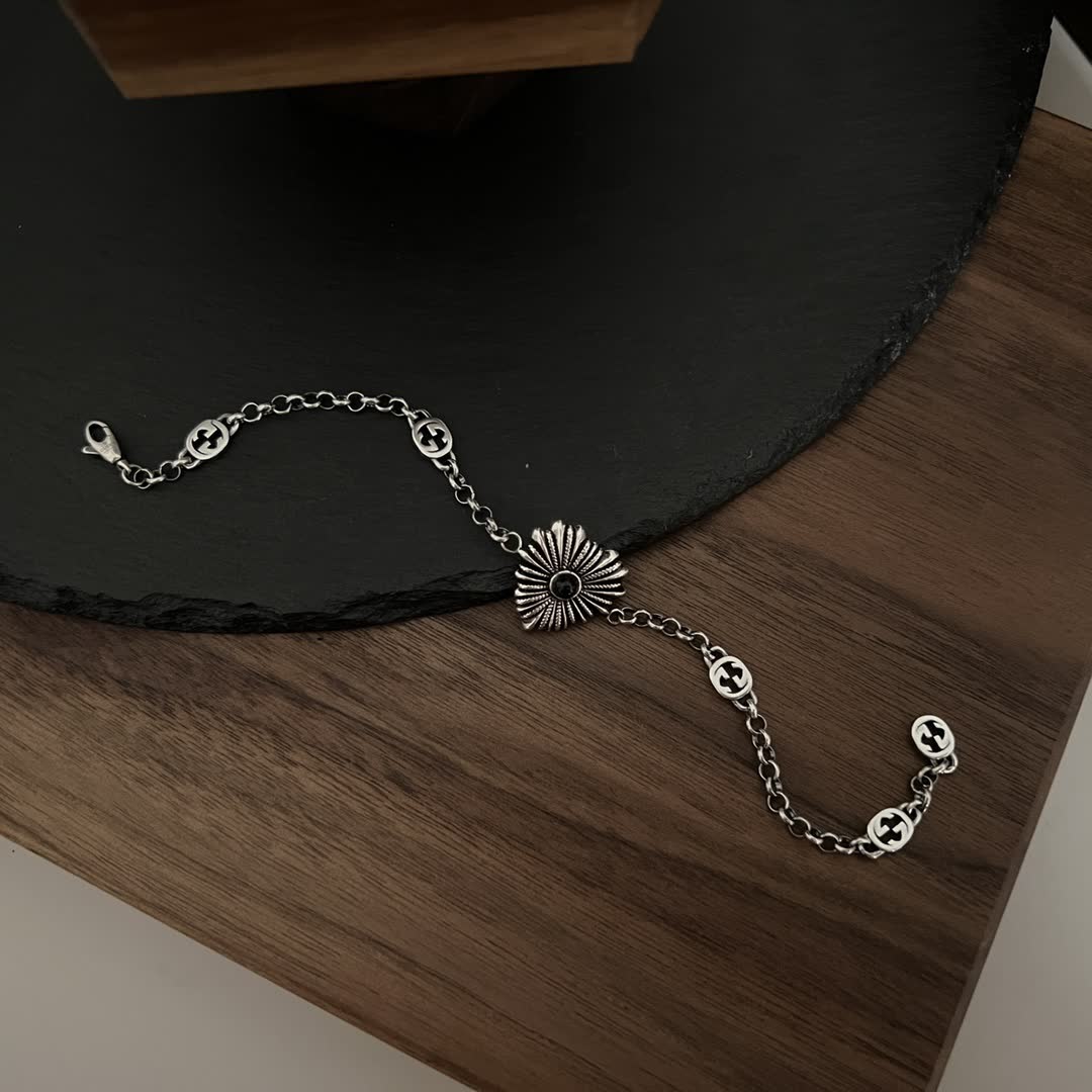 Gucci Silver Bracelet with Interlocking G Logo and Sunburst Design