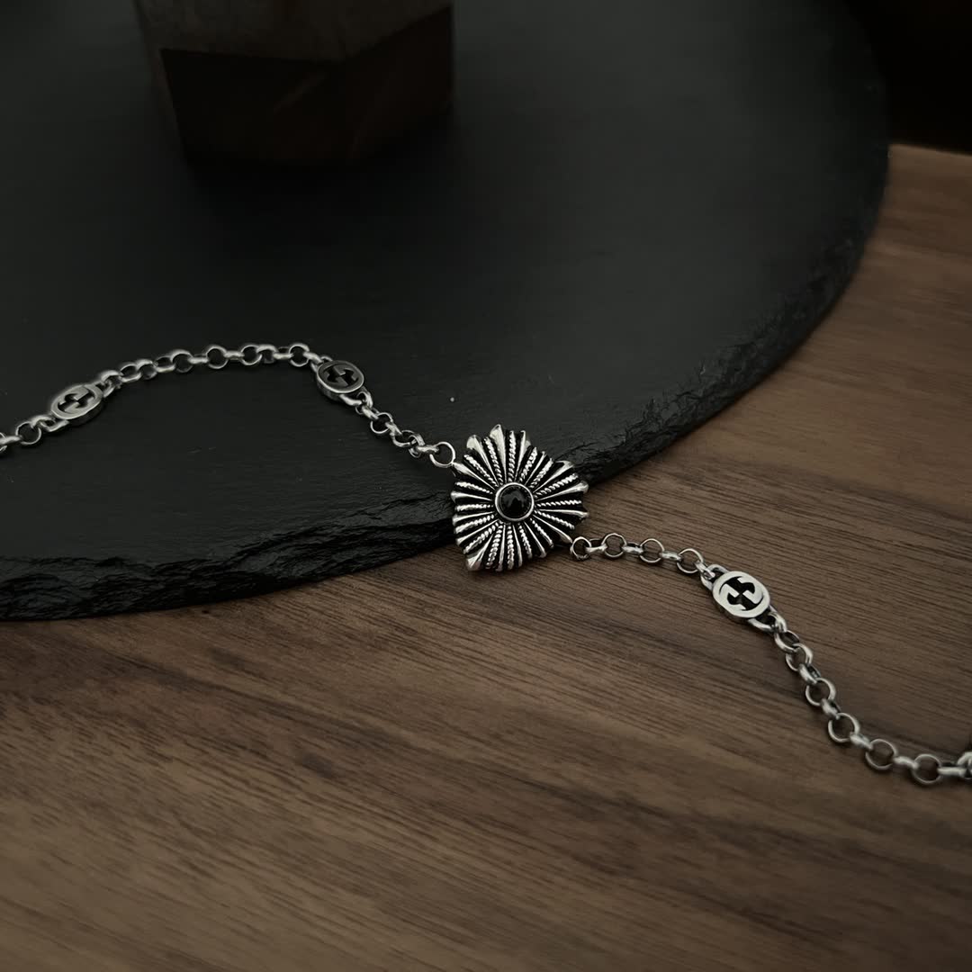Gucci Silver Bracelet with Interlocking G Logo and Sunburst Design
