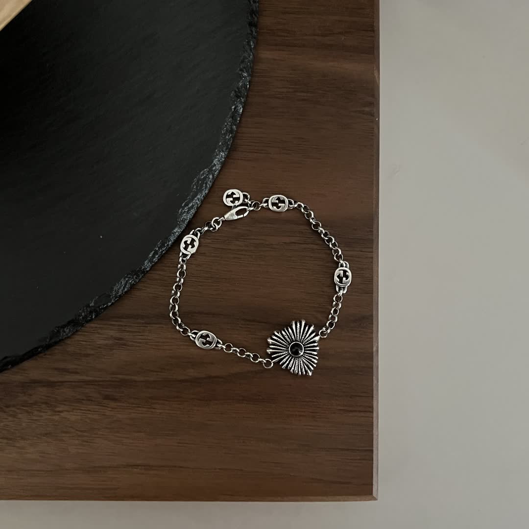 Gucci Silver Bracelet with Interlocking G Logo and Sunburst Design