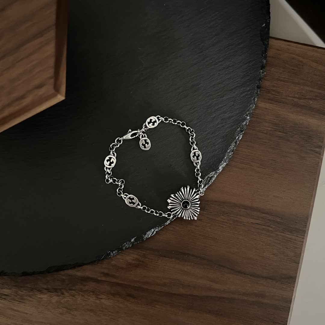 Gucci Silver Bracelet with Interlocking G Logo and Sunburst Design