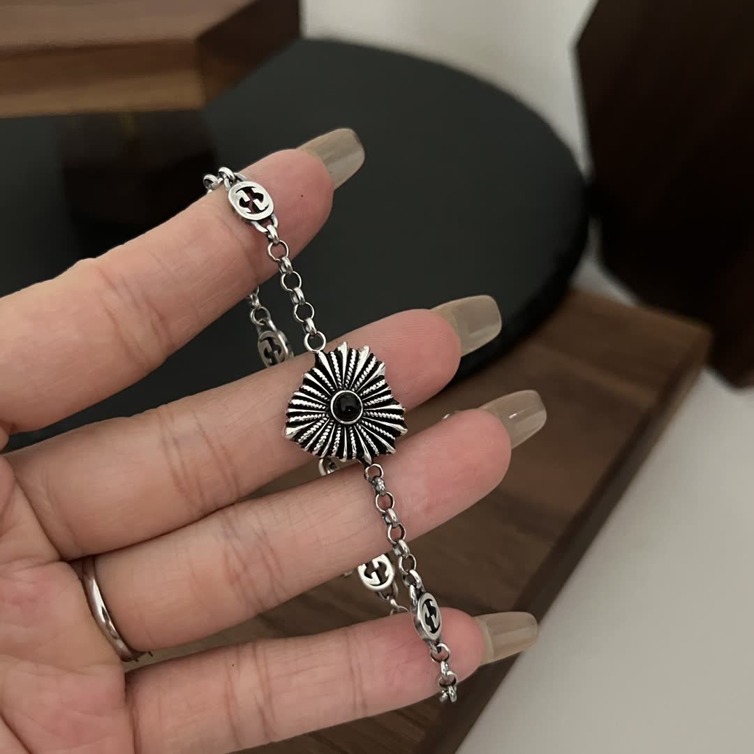 Gucci Silver Bracelet with Interlocking G Logo and Sunburst Design
