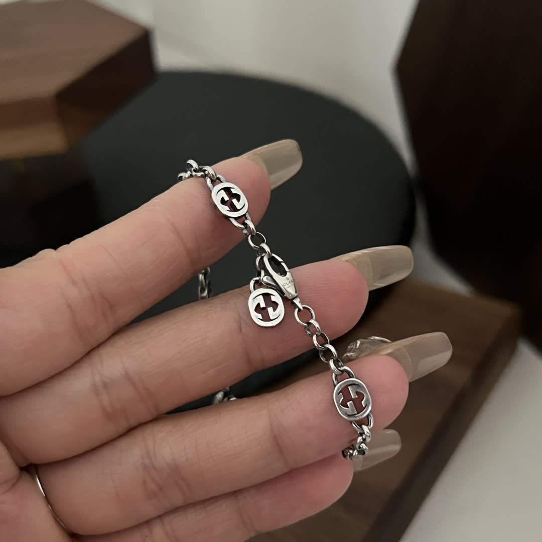 Gucci Silver Bracelet with Interlocking G Logo and Sunburst Design