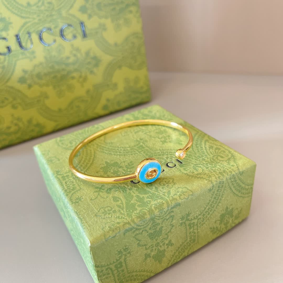 Gucci Gold Tone Blue Enamel Evil Eye Bracelet