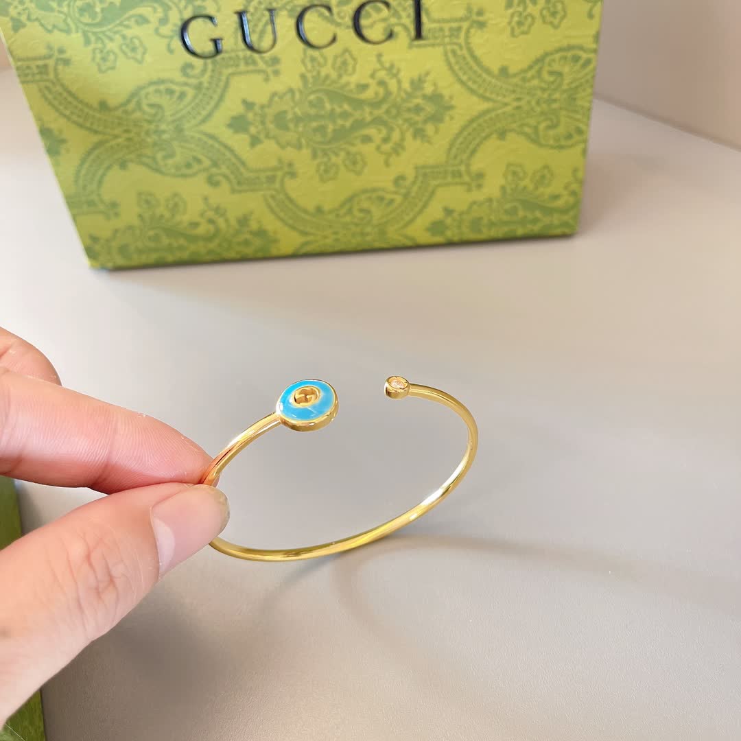 Gucci Gold Tone Blue Enamel Evil Eye Bracelet