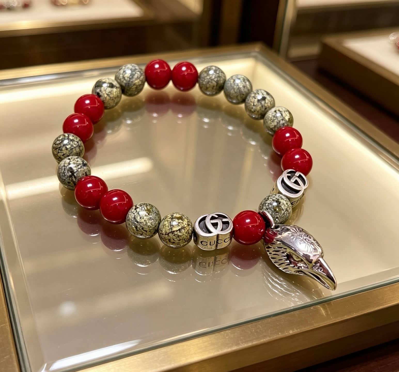 Gucci Red and Stone Bead Bracelet with Silver Charm Gucci Red and Stone Bead Bracelet with Silver Charm