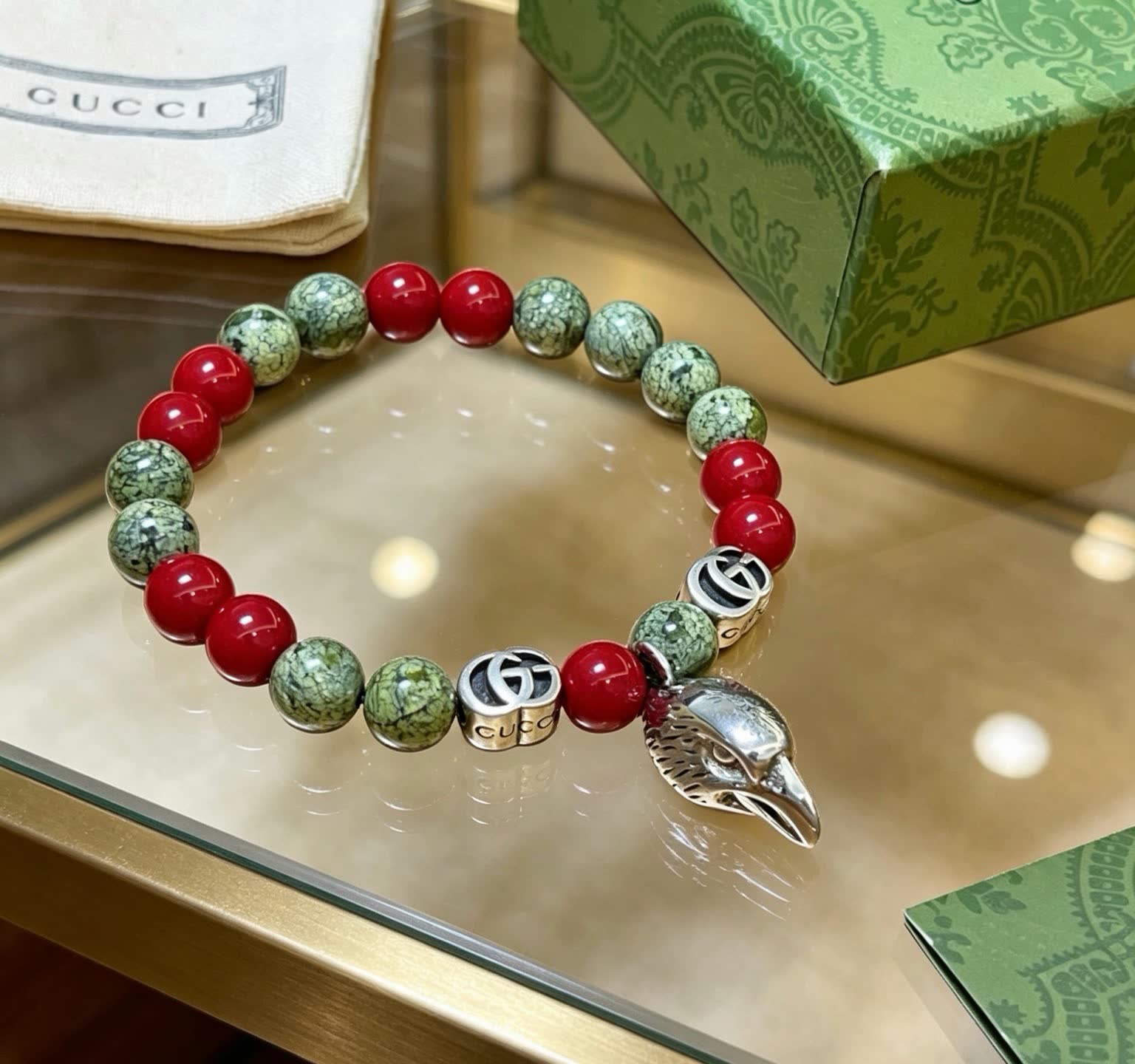 Gucci Red and Stone Bead Bracelet with Silver Charm