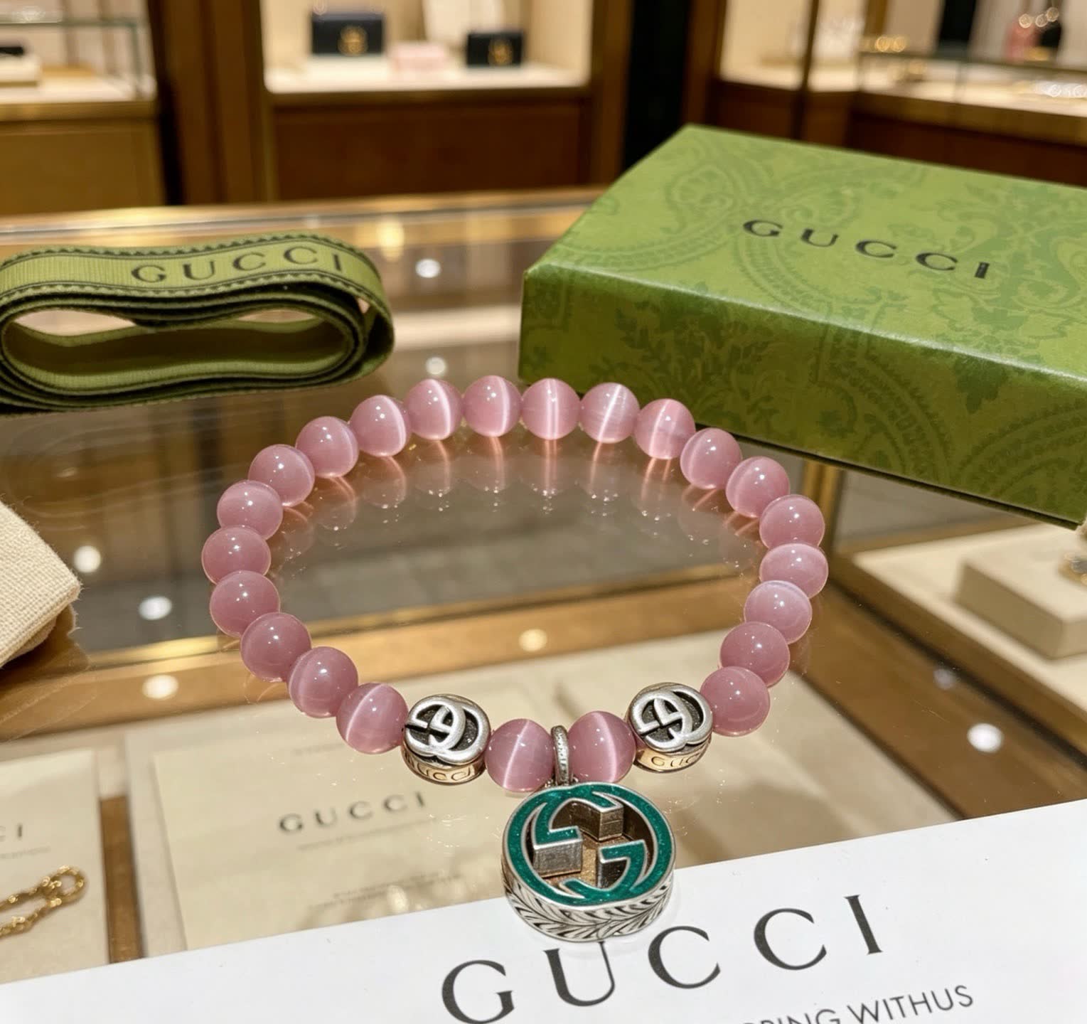 Gucci Pink Cat's Eye Bead Bracelet with Interlocking G Charm Gucci Pink Cat's Eye Bead Bracelet with Interlocking G Charm