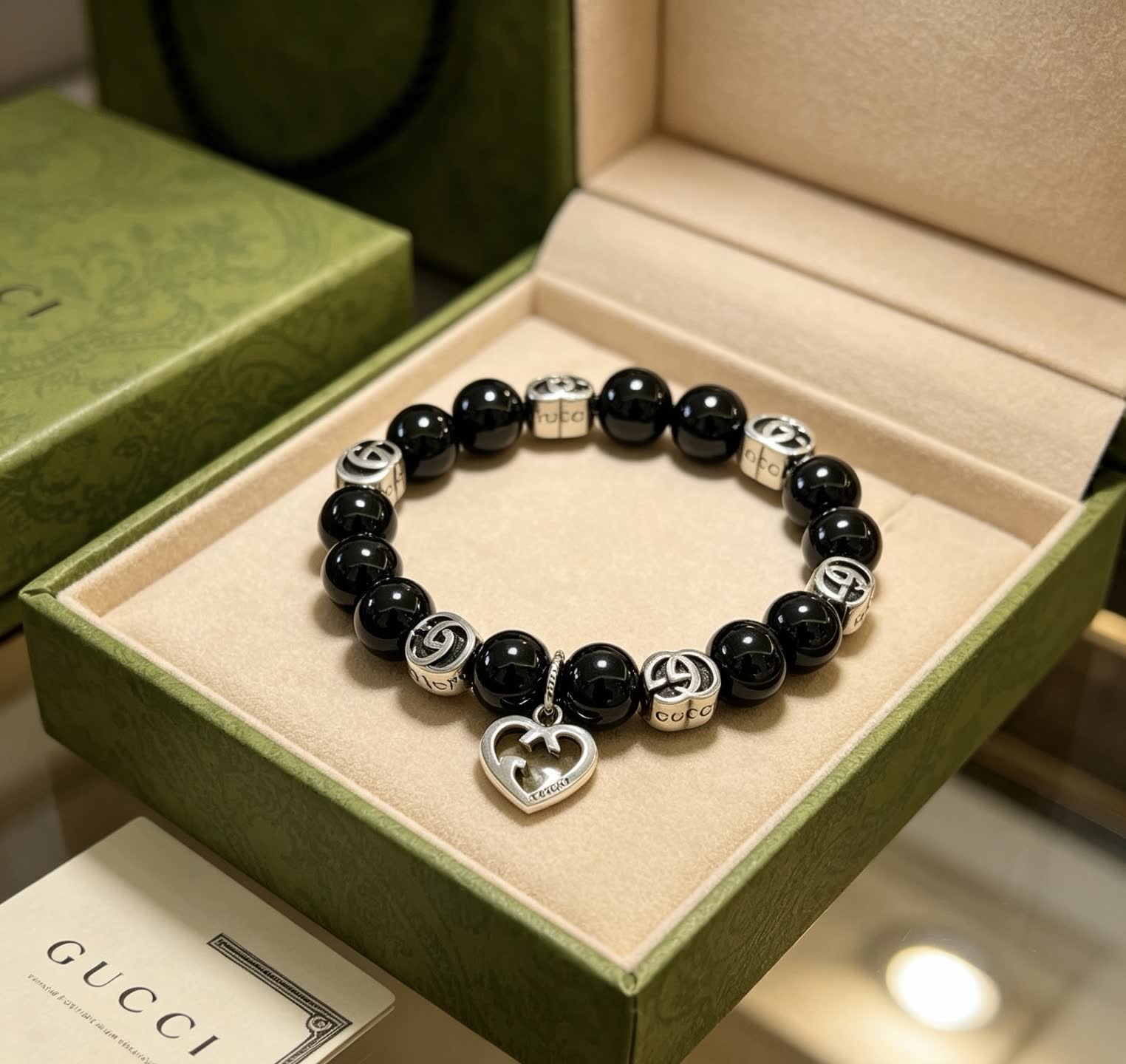 Gucci Black Bead Bracelet with Heart Charm