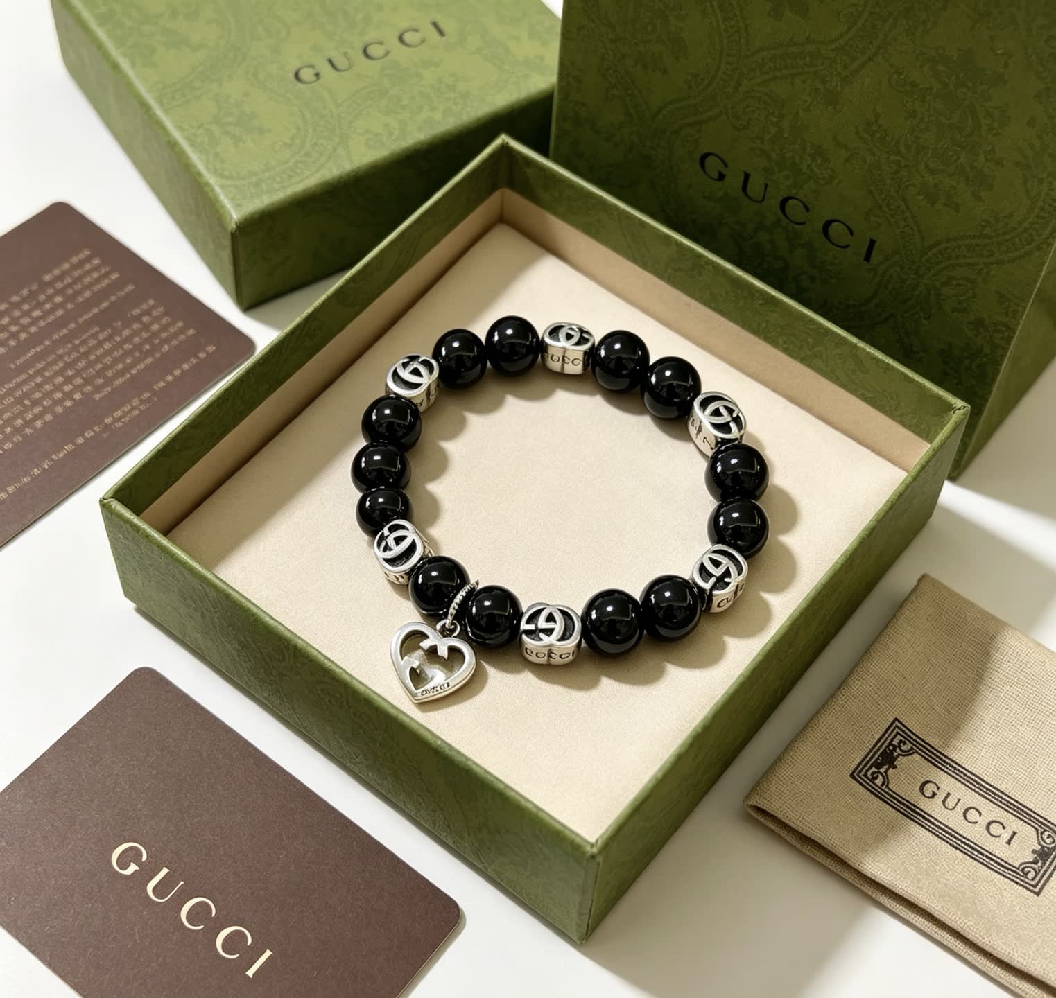 Gucci Black Bead Bracelet with Heart Charm