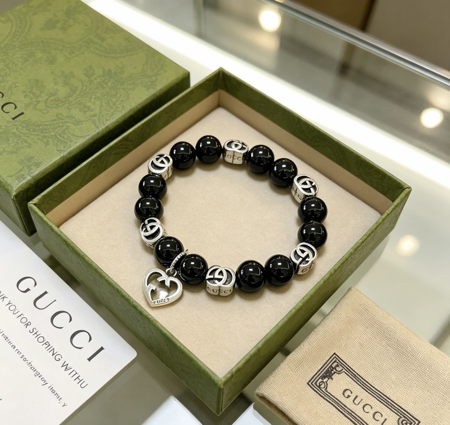 Gucci Black Bead Bracelet with Heart Charm
