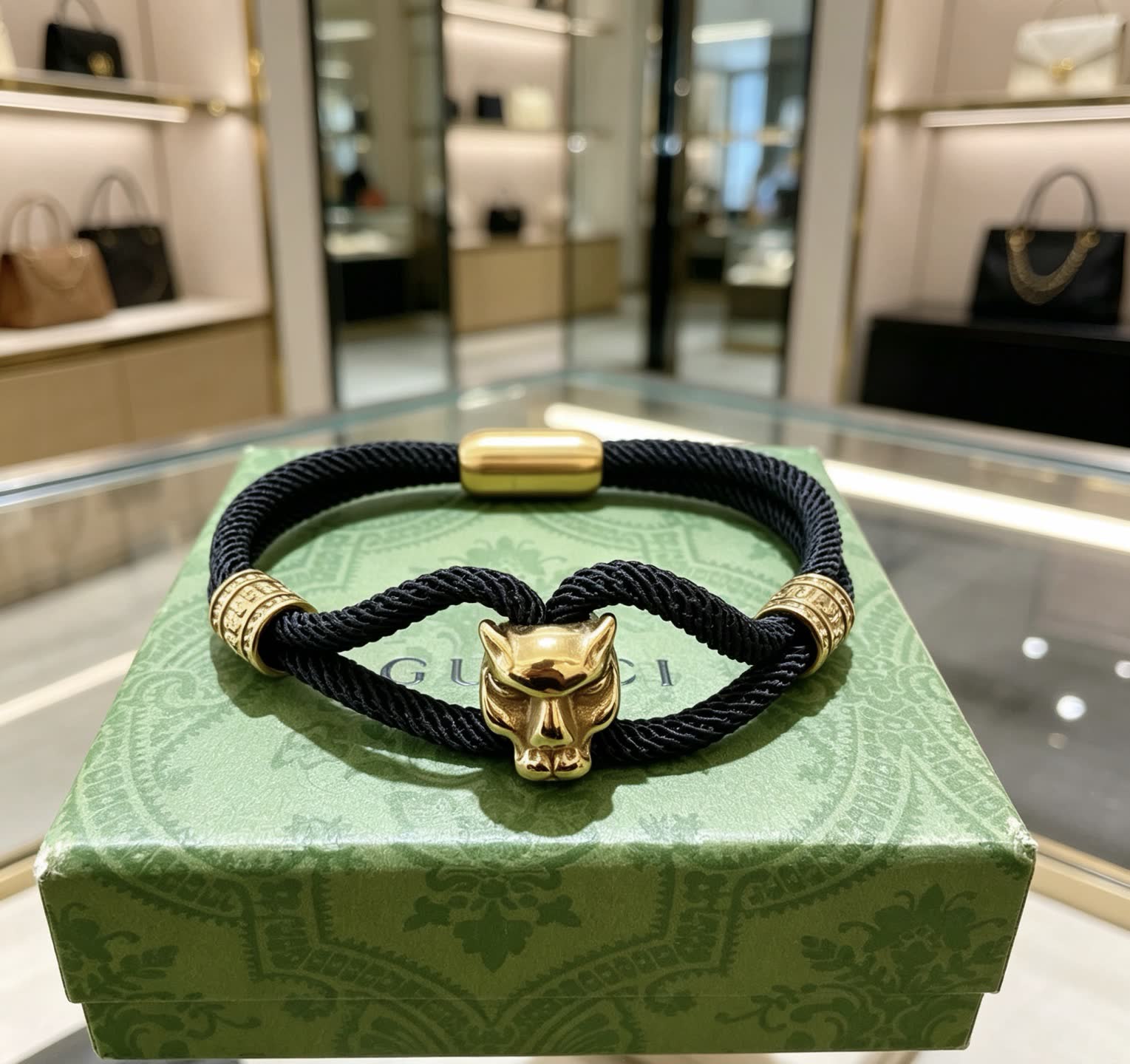 Gucci Black Rope Bracelet with Gold Panther Clasp