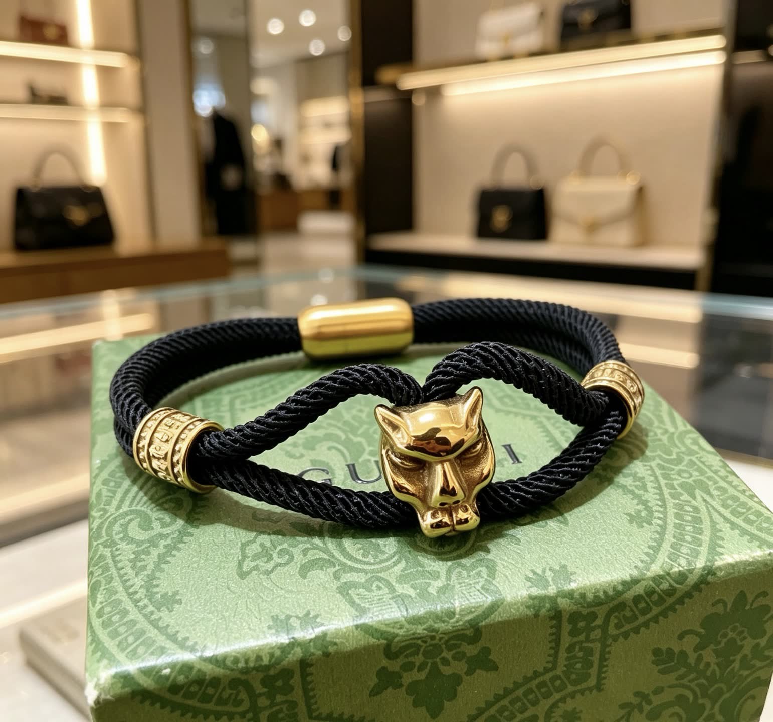 Gucci Black Rope Bracelet with Gold Panther Clasp