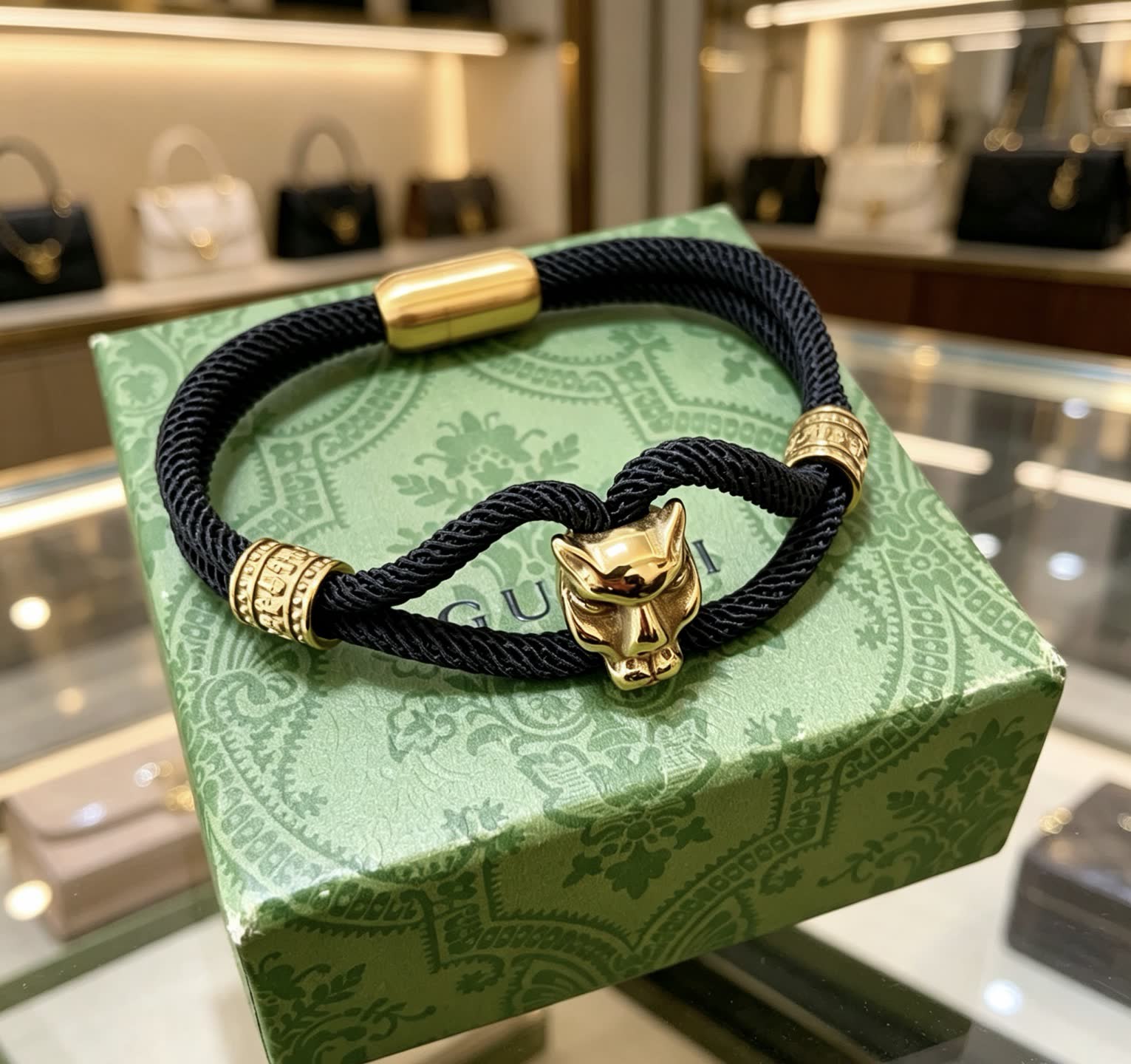 Gucci Black Rope Bracelet with Gold Panther Clasp