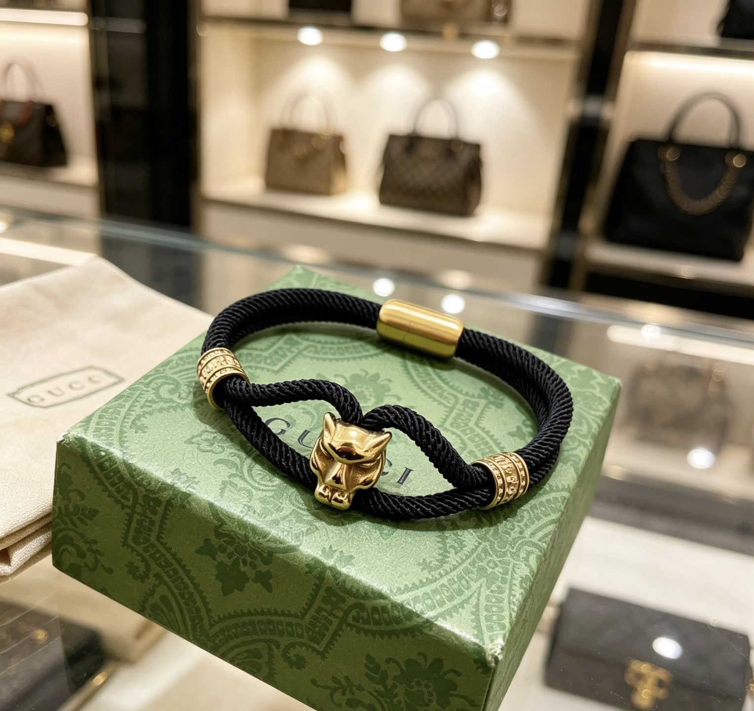 Gucci Black Rope Bracelet with Gold Panther Clasp