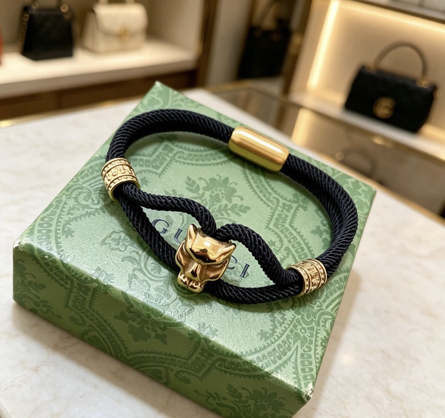 Gucci Black Rope Bracelet with Gold Panther Clasp