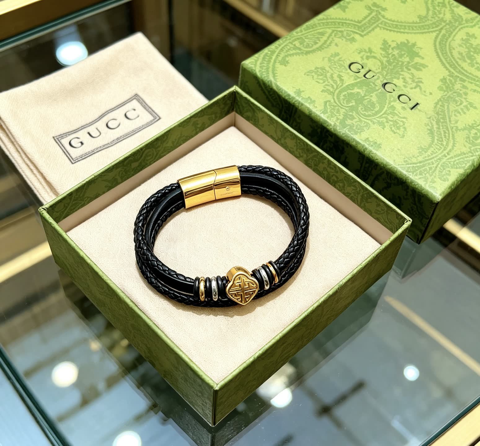 Gucci Black Braided Leather Bracelet with Gold Accents