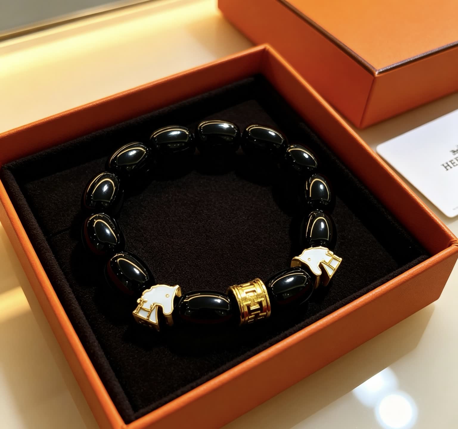 Hermes Hermès Black Beaded Bracelet with Gold Accents