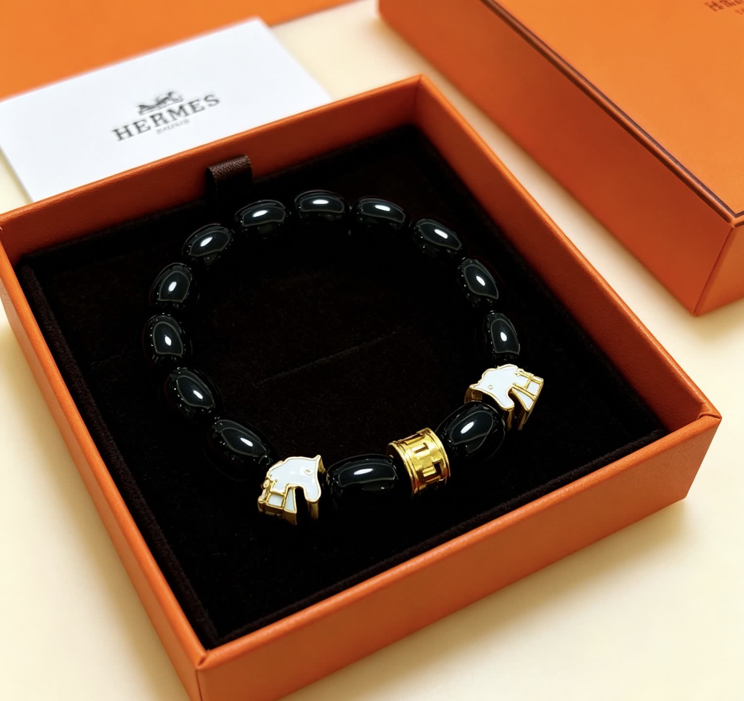 Hermes Hermès Black Beaded Bracelet with Gold Accents